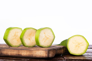 Musa × paradisiaca - Green banana slices on white background © Luis Echeverri Urrea