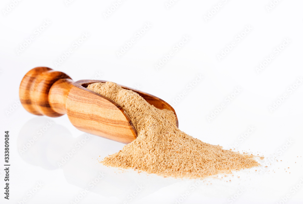 Poster aphrodisiac maca powder in wooden spoon - lepidium meyenii