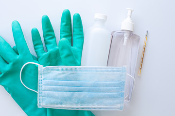 Images of face mask, protective gloves, alcohol, hand sanitizer and thermometer to arose people of health and hygienic sense