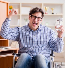 The disabled student studying at home on wheelchair