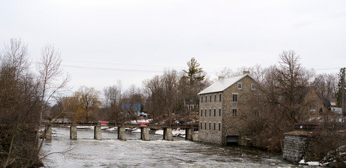 Fototapeta na wymiar An old mill on a river