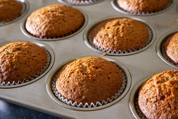 Fototapeta na wymiar Baking delicious muffins in a cupcake pan