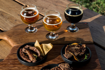 Different flavors of beer and food to taste