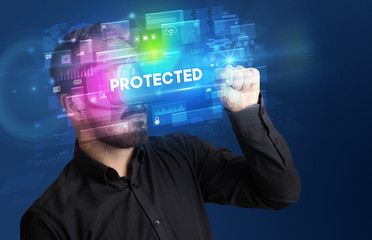 Businessman looking through Virtual Reality glasses with PROTECTED inscription, innovative security concept
