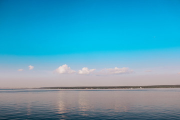 view of the lake from a boat and the sky with clouds