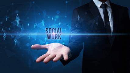 Elegant hand holding SOCIAL WORK inscription, social networking concept