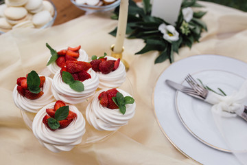 beautiful fruit dessert, fruit cake with strawberries and cream .