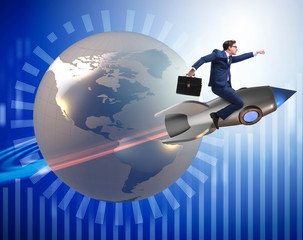 Fototapeta premium Businessman on the rocket in global business concept