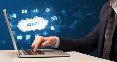 Businessman working on laptop with BIG DATA inscription, modern technology concept