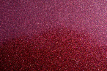 Abstract macro photography – Glitter texture on red steel surface