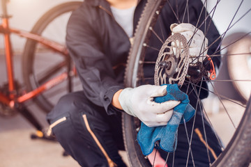 Bicycle maintenance, Rider is wiping the bike clean, Close-up.