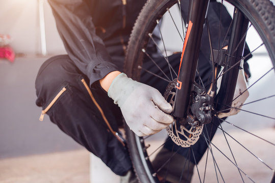 Bicycle Maintenance, Rider Is Assembling The Bicycle Parts, Close-up.