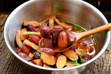 pot of jackfruit seeds cook with sauce, Vietnamese homemade vegan food from nut for vegetarian meal