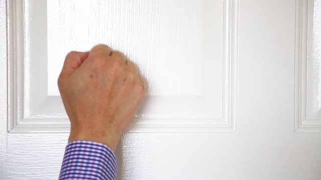 A Man Man Hand Knocking The Door