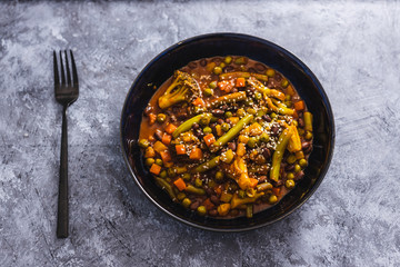 healthy plant-based food, mixed vegetable curry with herbs bread