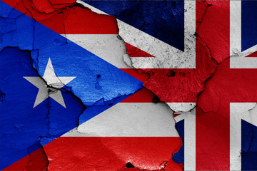 flags of Puerto Rico and UK painted on cracked wall
