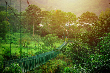 Fototapeta na wymiar Suspension bridge in the middle of the nature in Costa Rica