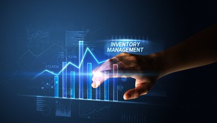 Hand touching INVENTORY MANAGEMENT button, business concept