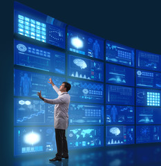 Doctor in telemedicine concept pressing buttons