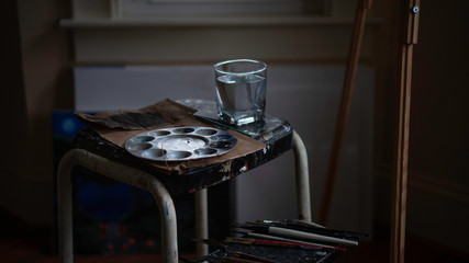 art supplies on rustic stool