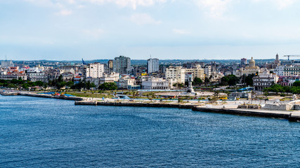 Havana, Cuba downtown skyline at dusk with cruise ship in the background.