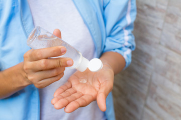 COVID-19 Hands putting alcohol gel on