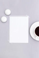 Blank paper and white coffee cup, candle