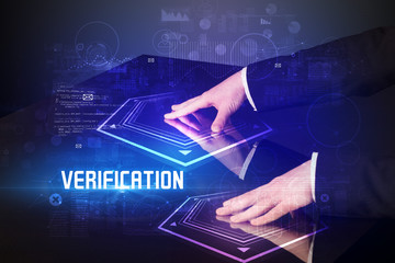 Hand touching digital table with VERIFICATION inscription, new age security concept