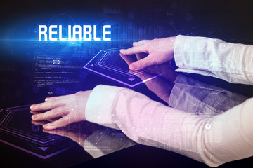 Hand touching digital table with RELIABLE inscription, new age security concept