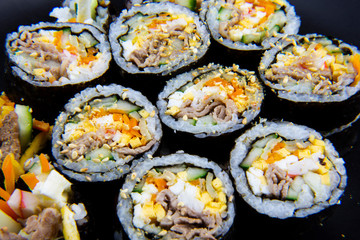 Korean food, wraping rice with seaweed and filled with vegetables and beef