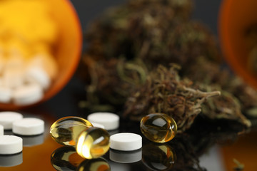 On table are hemp tablets and vegetable capsules. Wide range cannabis products with varying levels essential psychoactive substance. Reliable product information. Intensity effect when used