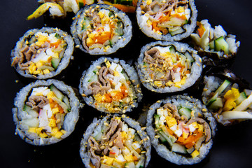 Korean food, wraping rice with seaweed and filled with vegetables and beef