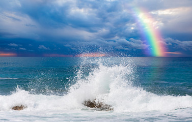 Storm on the sea with amazing rainbow 