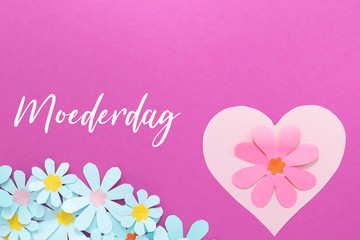 Moederdag, Dutch word for Mothers day with paper flowers. Room for text. 