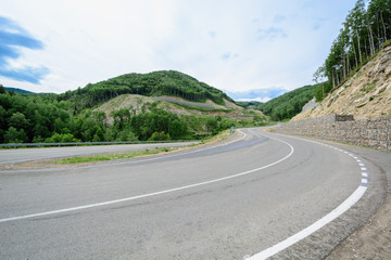 Fototapeta premium Serpentine road for cars in the rocky mountains.
