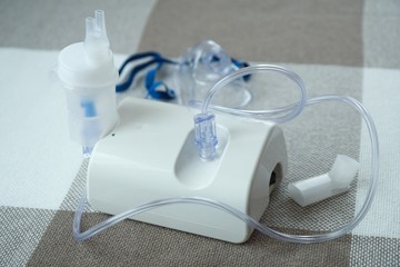 Medical equipment for inhalation with respiratory mask, nebulizer.  Asthma breathing treatment. Bronchitis, asthmatic health equipment.