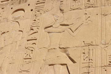 Ancient egyptian paintings and hieroglyphs on the wall in Karnak Temple Complex in Luxor, Egypt