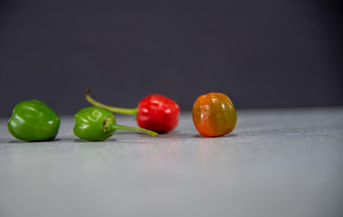 Fruits of goat pepper (capsicum chinense) on dark background