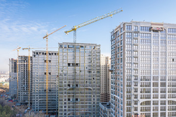 Fototapeta na wymiar development of new residential area. modern high-rise apartment buildings under construction. aerial photo