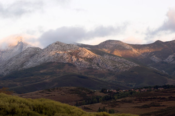 Landscape of mountains with small village in a cloudy day