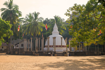 View of the ancient Buddhist temple of Ambastala Dagoba on a sunny morning (I century AD). Mihintale, Sri Lanka