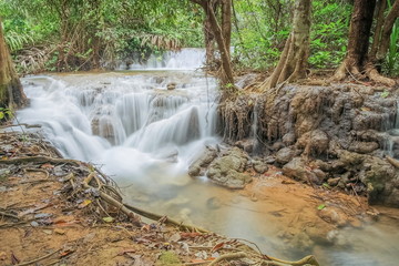 view of silky waterfall around with green forest background, Kroeng Krawia Waterfall, Sangkhla Buri, Kanchanaburi, west of Thailand.