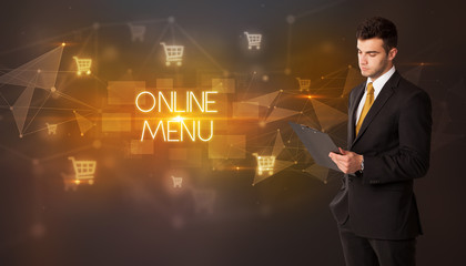 Businessman with shopping cart icons and ONLINE MENU inscription, online shopping concept