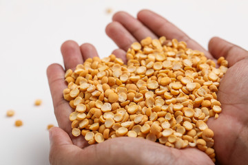 Dried chickpea lentils in wooden bowl on white background , Split Chickpea Also Know as Chana Dal