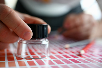 Employee refueling cartridge service holds magnifying glass in hand. Color print of statistics offset organization gives customer an order products for distribution during promotion concept