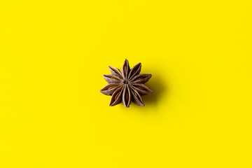 star anise on a yellow background