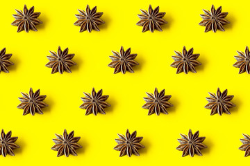 seamless pattern of star anise on a yellow background
