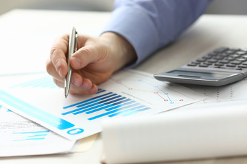 Accountant Manager Controlling Expense Income. Man Hold Pen at Work Table, Check Financial Data...