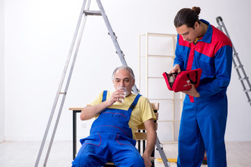 Two contractors in first aid concept