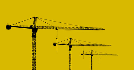 Cranes isolated on yellow background. Cranes are large and tall machines used for moving objects that weigh heavy to hang on to the protruding arm.